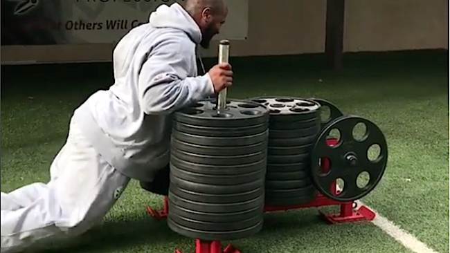 james Harrison pushing weighted sled