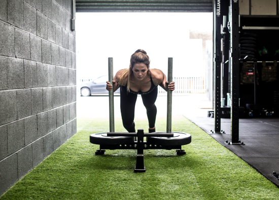 Sled push girl