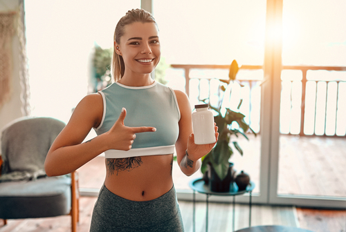 fitness girl with supplement